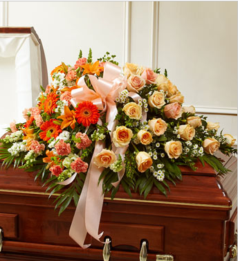 Peach funeral casket spray