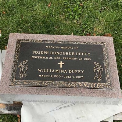 bronze memorial with pink granite