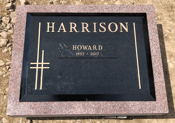 Black flat grave marker with minimalist cross design