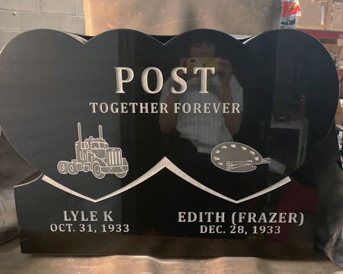 Black granite companion monument with mountain and truck engraving