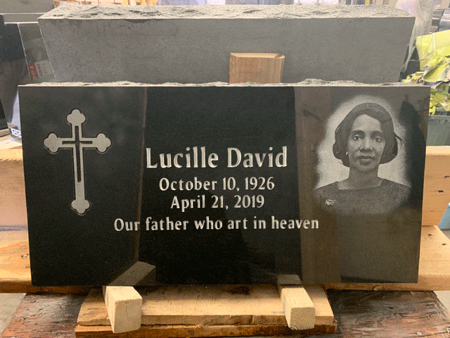 Black granite flat grave marker with an engraved Orthodox cross and a laser-etched portrait