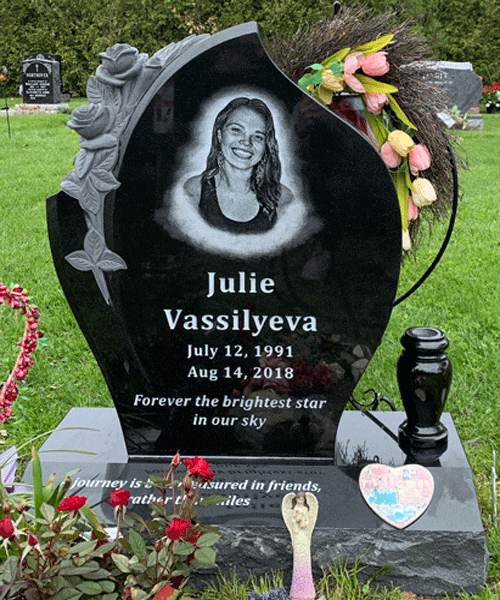 Black granite headstone with a carved rose and a laser-etched portrait
