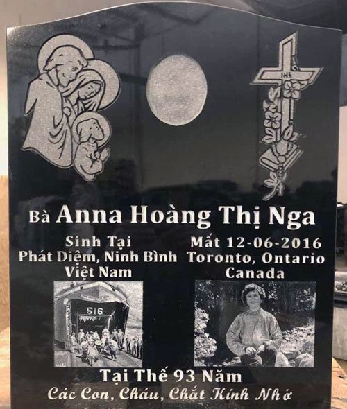 Black granite upright headstone with orchid cross portrait and photo tile