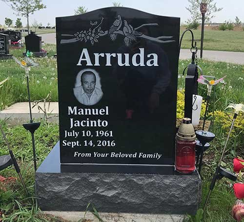 Black granite upright headstone with portrait and dove engraving