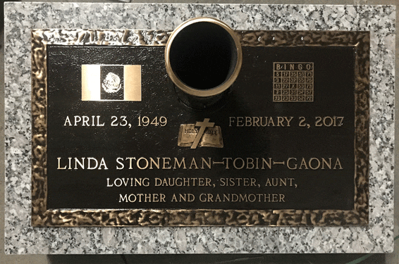 Bronze grave marker with center vase and service emblems