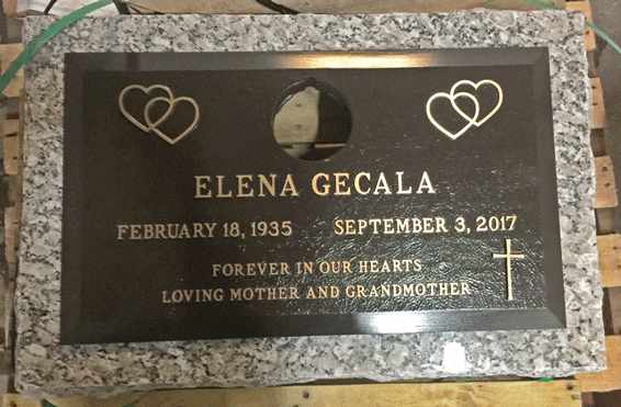 Bronze grave marker with heart emblems and oval portrait