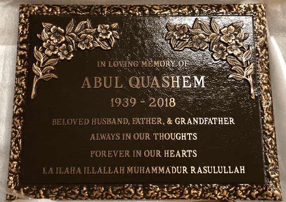 Bronze memorial marker with rose corner border