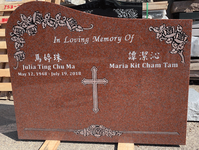 Mahogany granite upright headstone with carved rose corners and an engraved cross, English and Chinese inscription