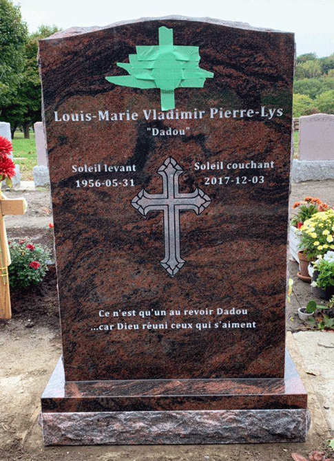 Mahogany granite upright headstone with a painted radiant cross and a large ornate engraved cross