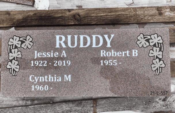Pink granite marker with floral corner artwork