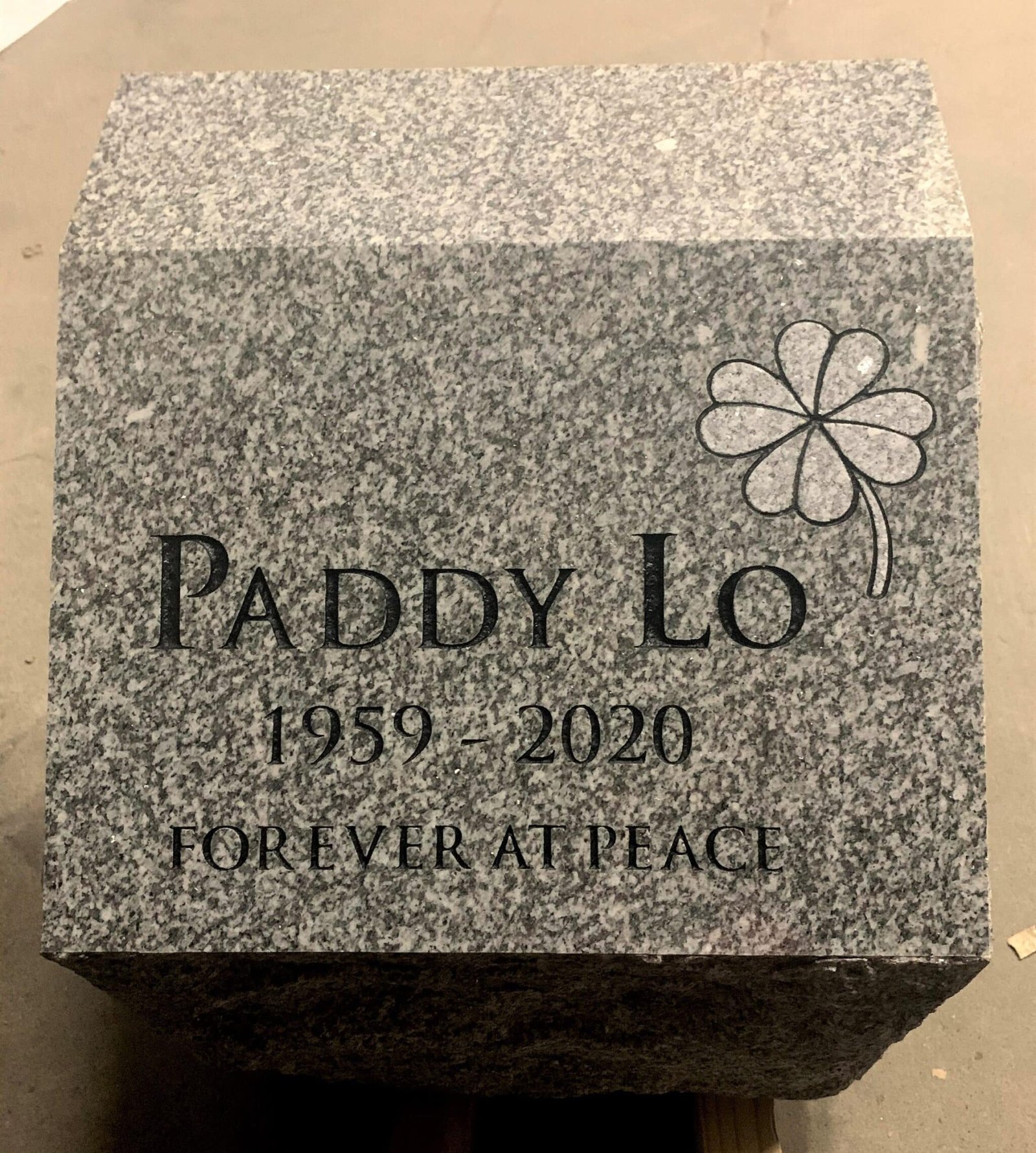 Small gray granite flat marker with shamrock