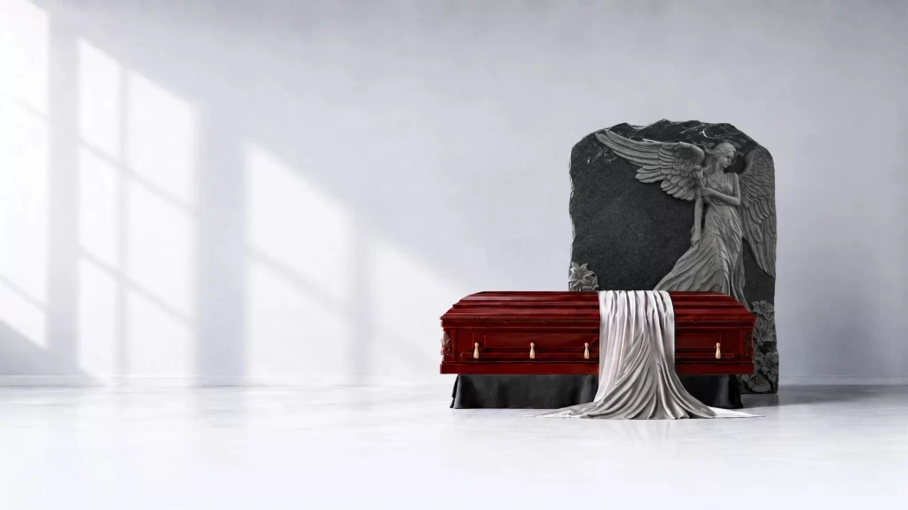 Mahogany casket with white drape and granite angel monument for Toronto and GTA families