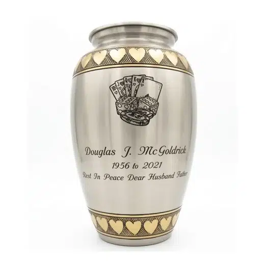 Metal cremation urn with a custom engraved inscription and design by Haven Casket and Monument
