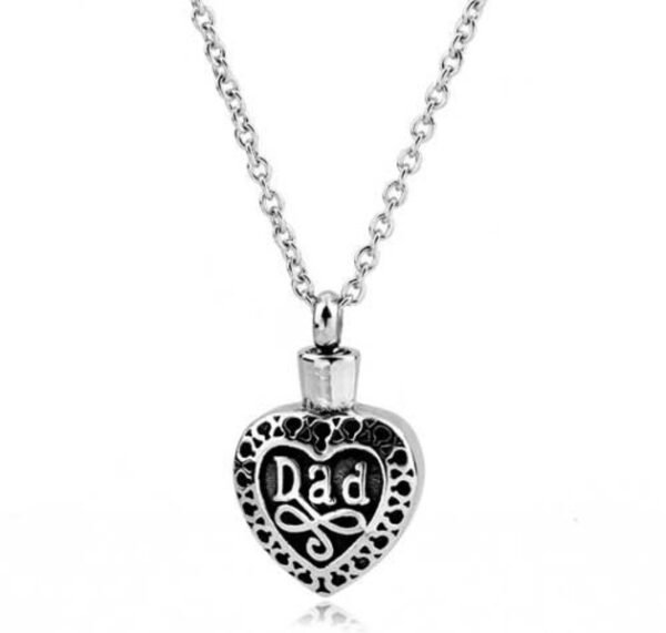 Stainless steel heart cremation pendant engraved 'Dad' with a filigree border on a chain