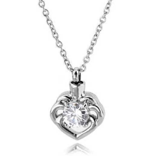 Silver-tone heart cremation pendant set with a clear crystal on a chain
