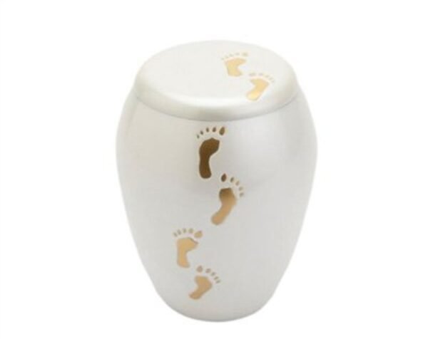 White infant urn with engraved baby footprints
