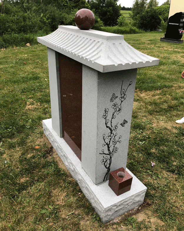 Side view of Asian roof family columbarium with floral etching