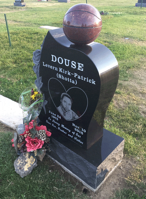 Black granite angel wing monument with round top