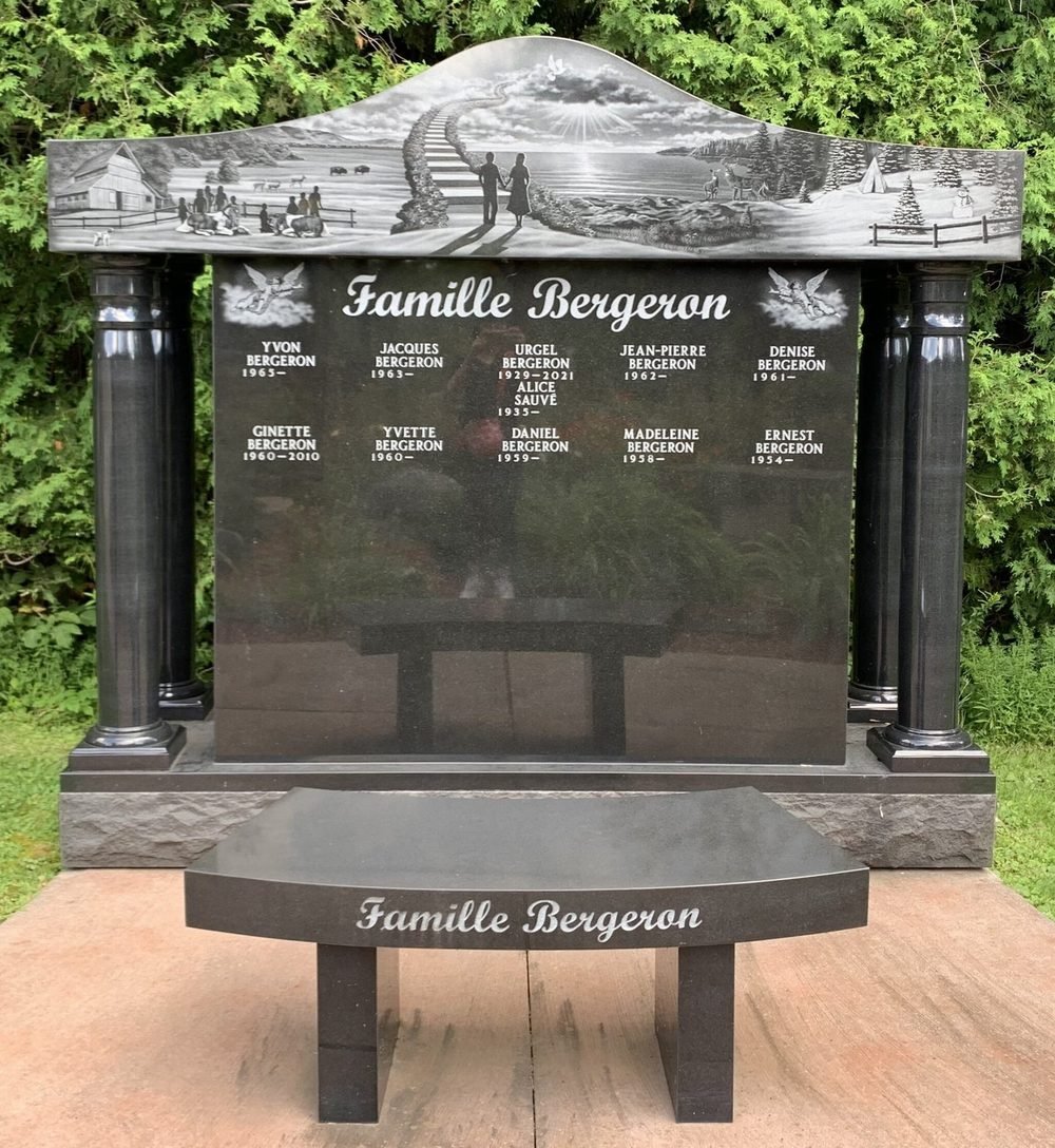 Black granite family columbarium with a laser etched scene and columns
