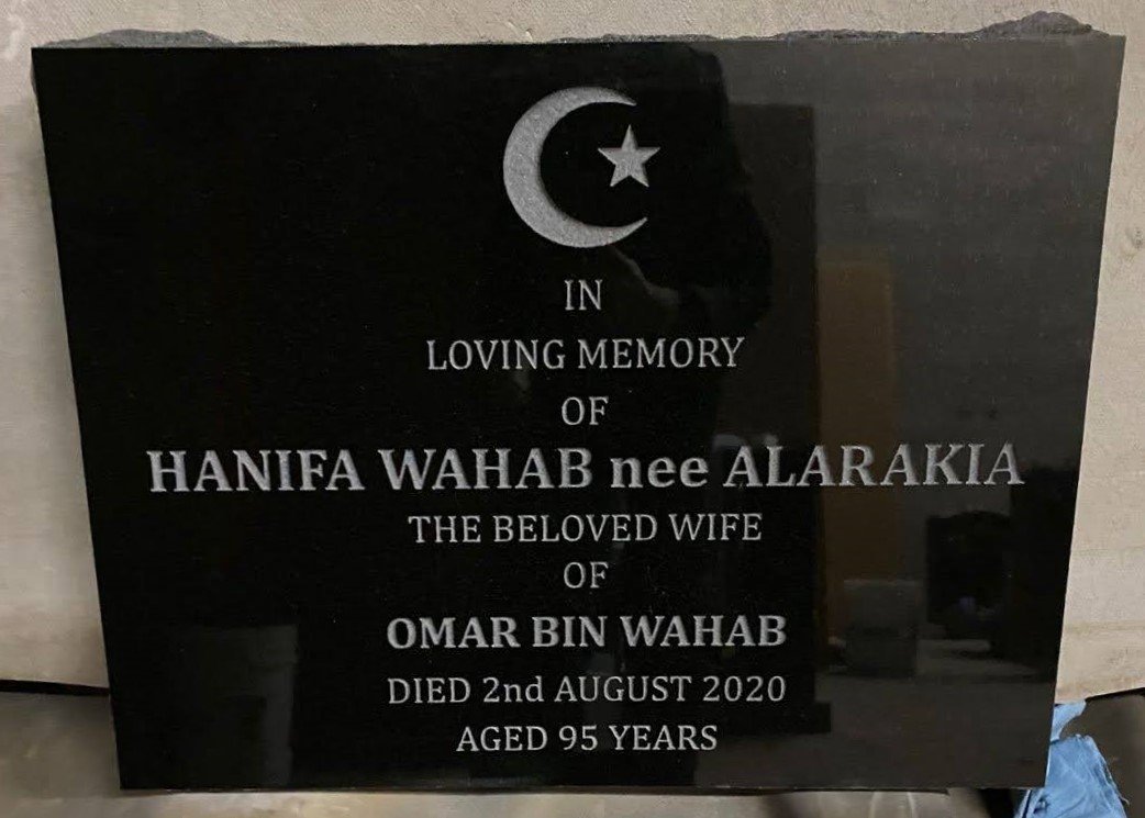 Black granite flat marker with crescent and star