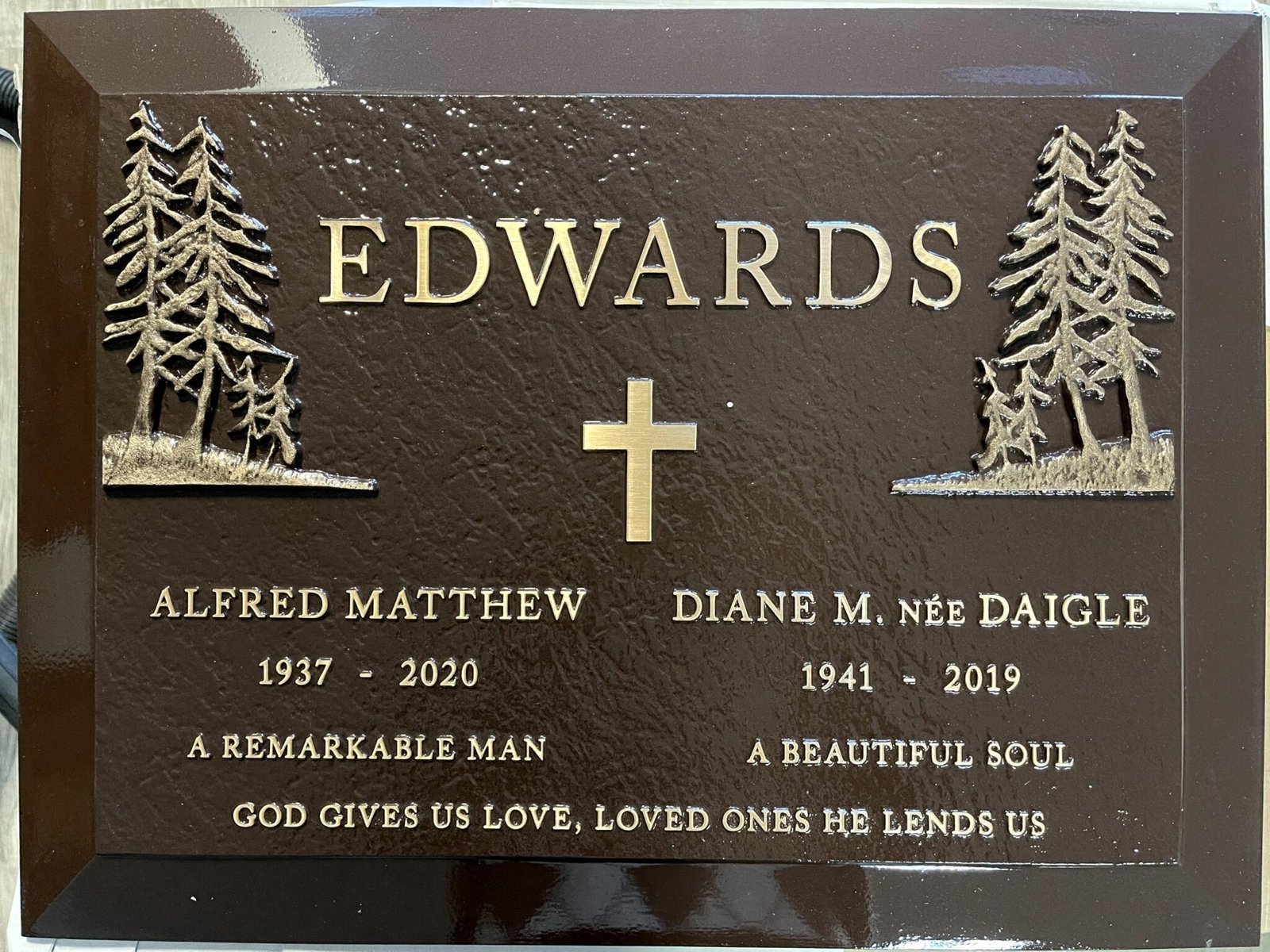 Bronze companion marker with cross and evergreen tree etchings