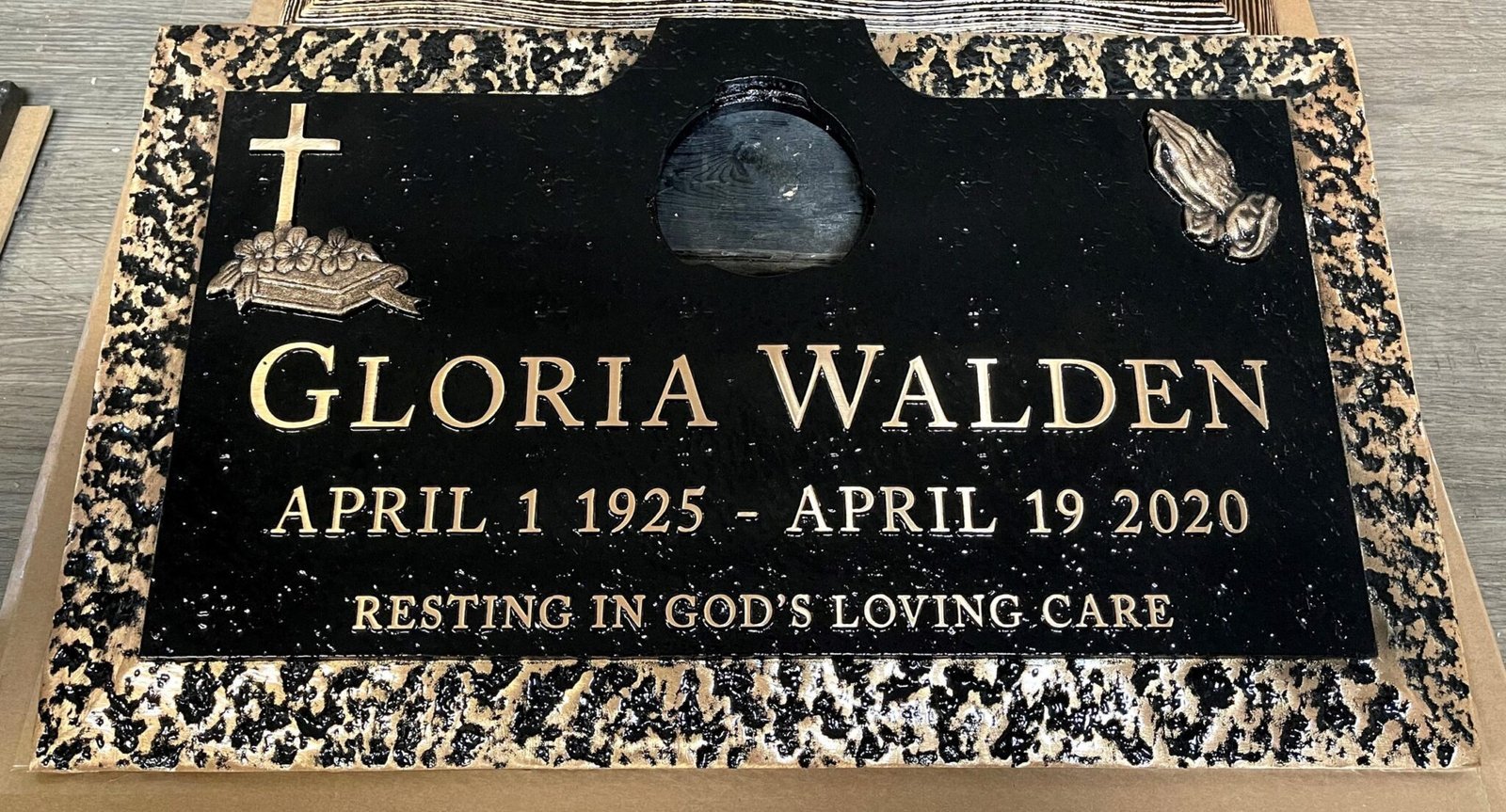 Bronze marker with cross and rose border
