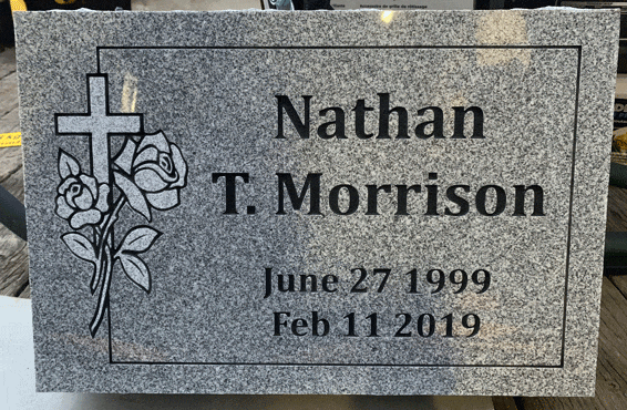 Gray flat marker with cross and rose