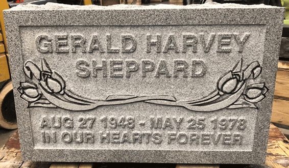 Gray flat marker with floral branch carving