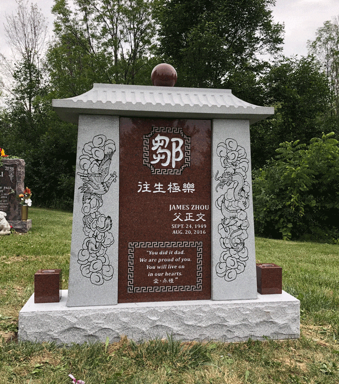 Gray granite family columbarium with Asian roof and brown panel