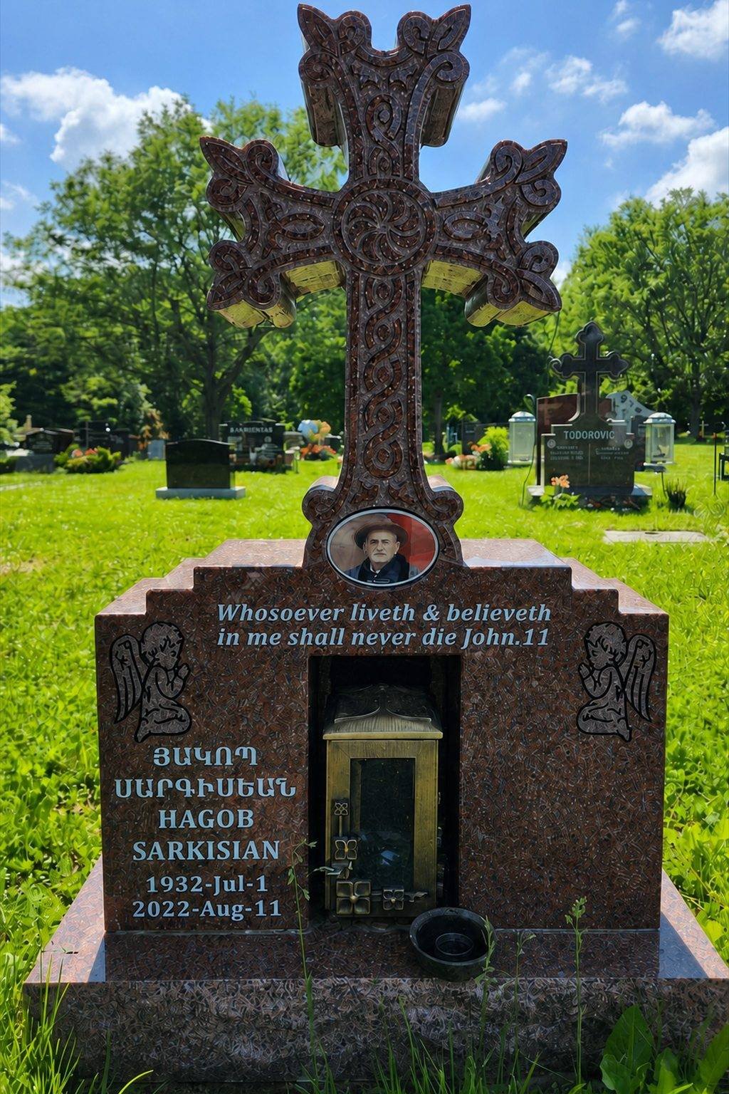 Indian Red granite Armenian khachkar style cross monument in a cemetery