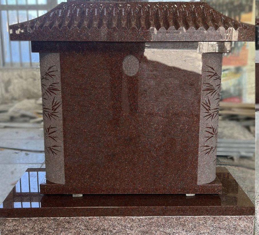 Indian Red granite pagoda monument with carved bamboo columns