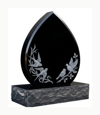 Black granite teardrop-shaped headstone with carved birds