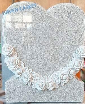 White Pearl granite heart shaped headstone with a carved rose garland
