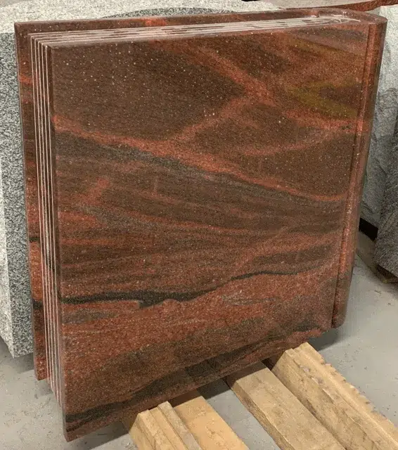 Aurora granite book shaped monument with carved page edges, shown before engraving