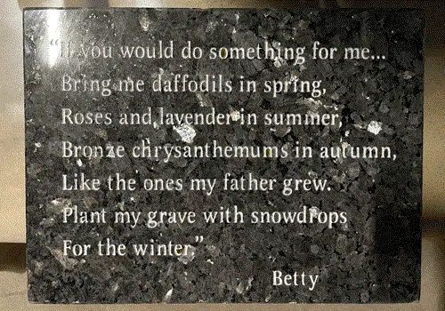 Blue Pearl granite flat marker with a polished silver fleck finish, engraved with a memorial verse and a first name