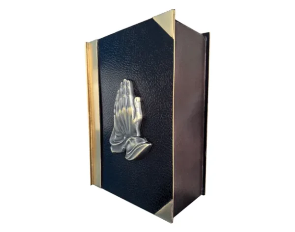 Book of Prayers MU256, book shaped metal urn, black leather look cover, brass spine and corners, raised praying hands