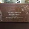 Engraved Walnut Urn with Golfer and Airplane Dark walnut wood urn with silver filled engraving of a golfer, an airplane and a French memorial inscription