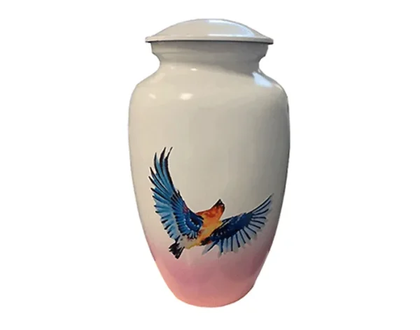 Eternal Metal Urn MU236 Eternal Metal Urn MU236, glossy white metal urn with a painted blue and orange bird in flight and a pink base