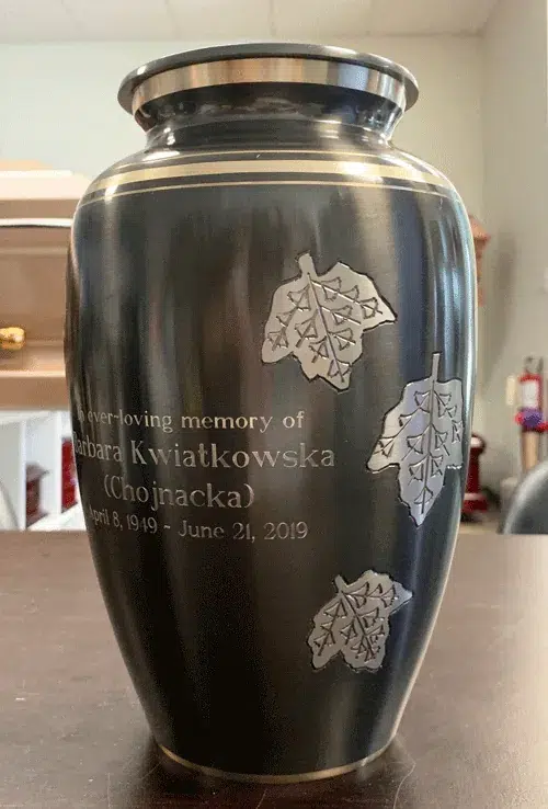 Falling Leaves Metal Urn MU184 Engraved Falling Leaves Metal Urn MU184, charcoal grey with three silver maple leaves and an engraved name and dates