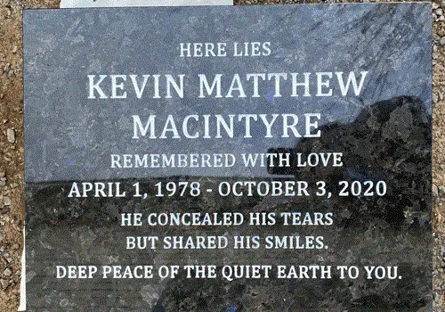 Galactic Blue granite flat marker with an engraved inscription