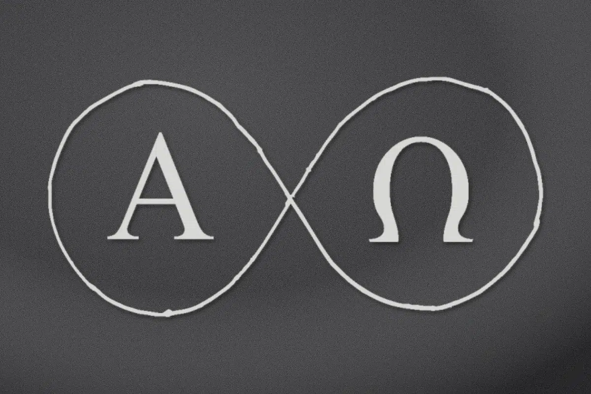 Alpha and Omega inside an infinity loop engraved on black granite