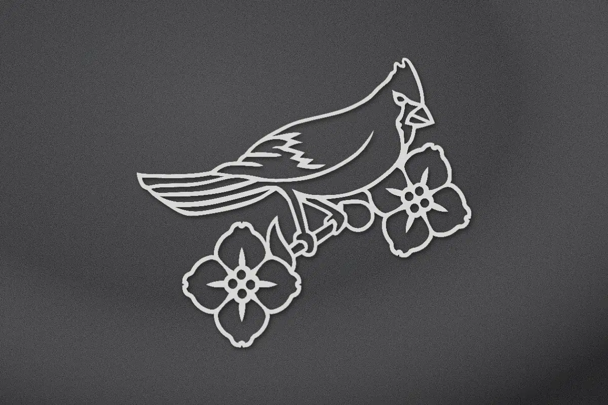 Cardinal on a dogwood branch engraved on black granite