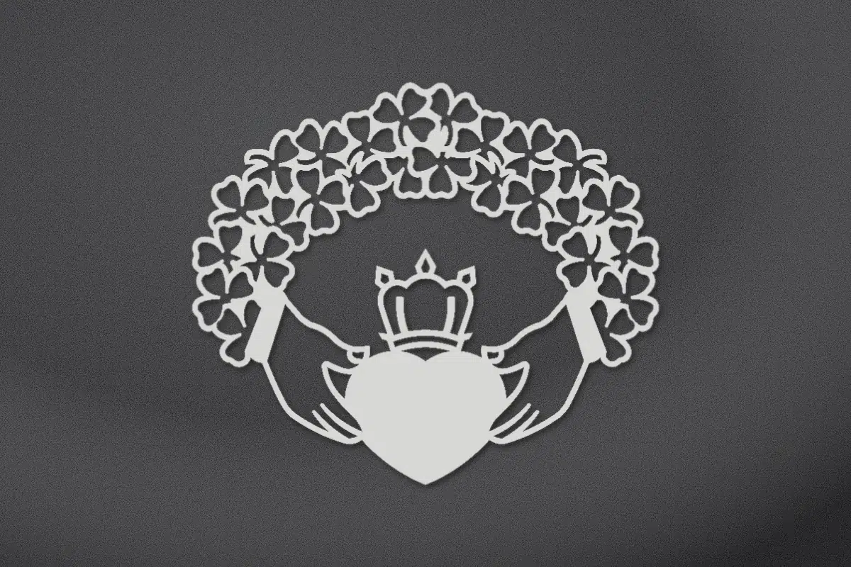 Claddagh with a shamrock wreath engraved on black granite