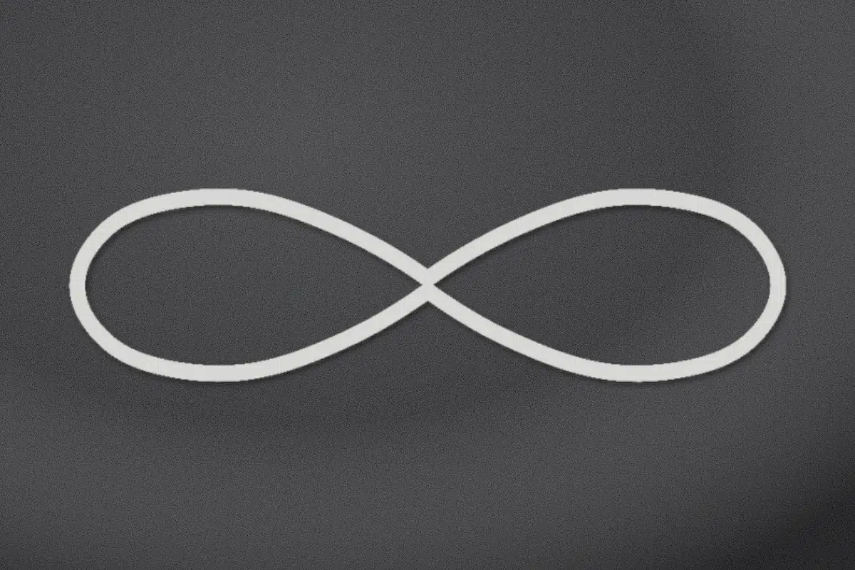 Infinity symbol engraved on black granite