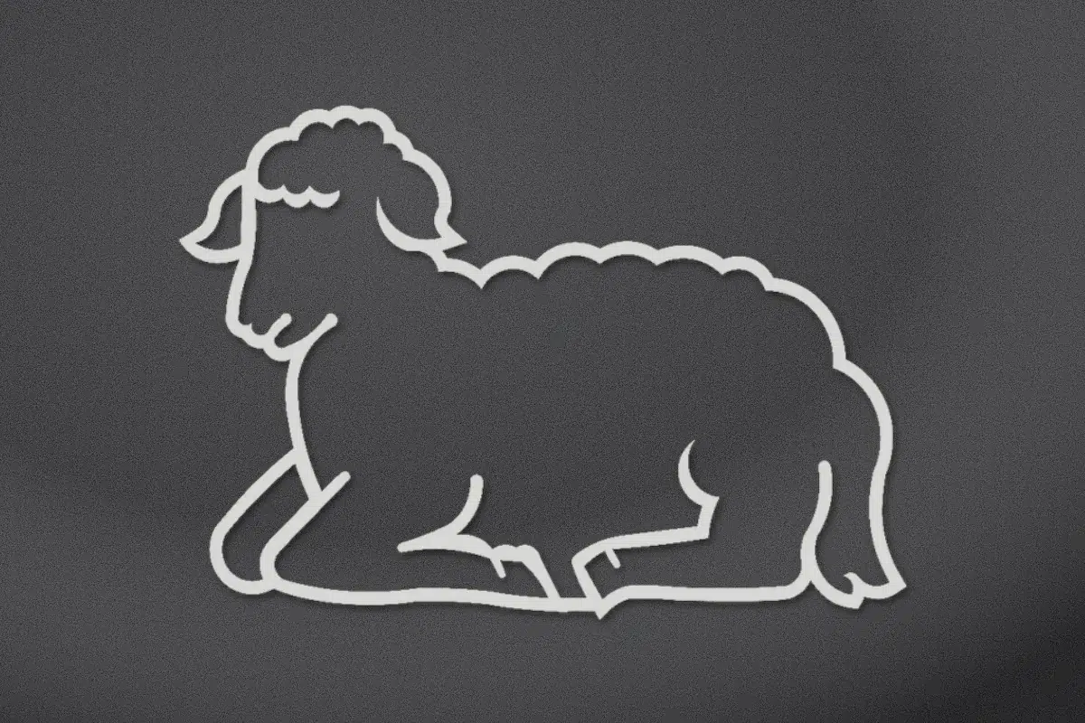 Resting lamb engraved on black granite