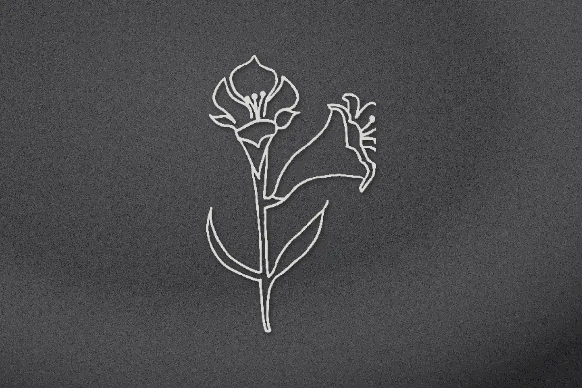 Two lily blooms with leaves engraved on black granite