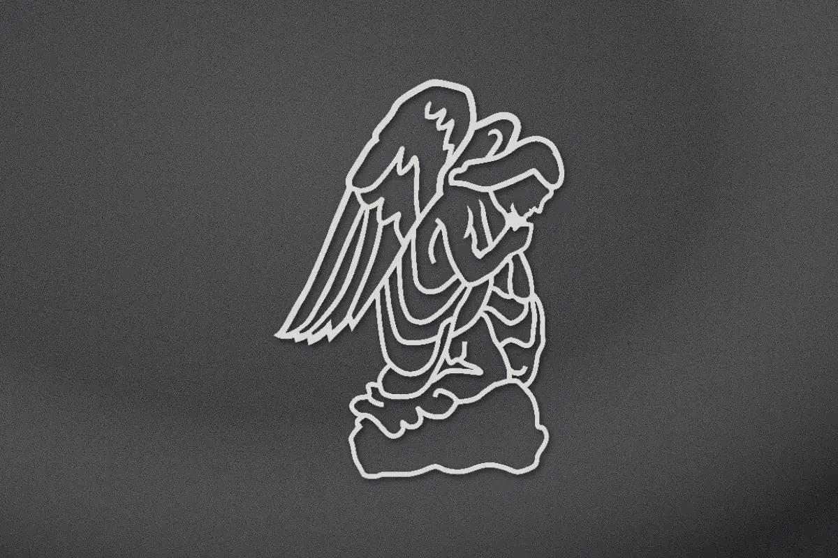 Kneeling angel engraved on black granite
