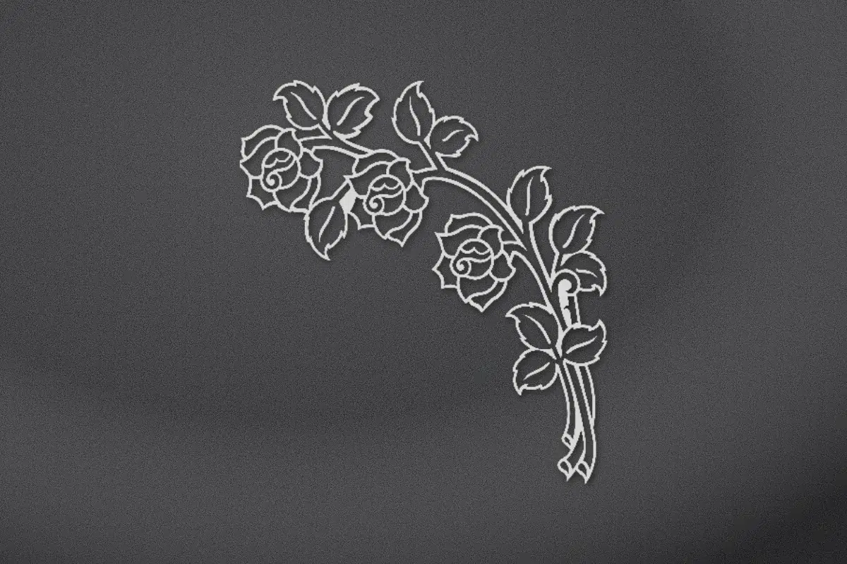 Rose corner spray engraved on black granite