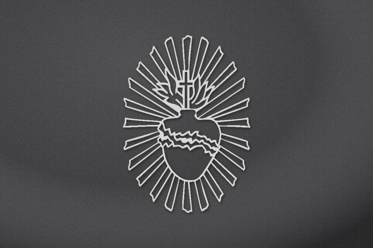 Sacred Heart with thorns, flames and cross engraved on black granite