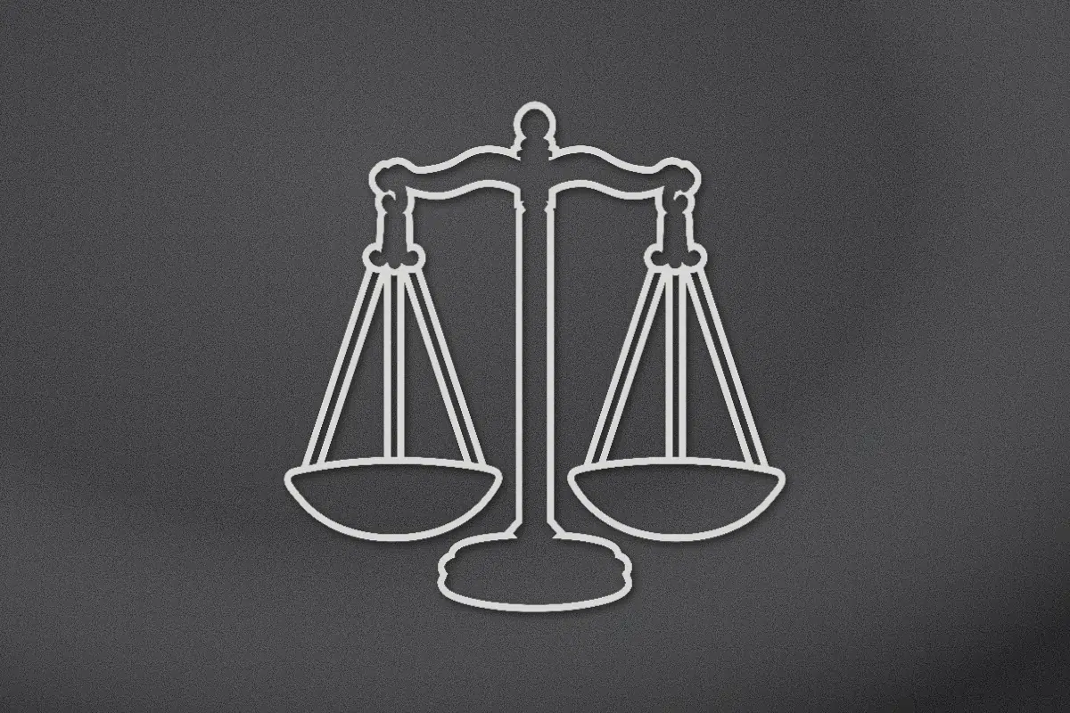 Scales of justice engraved on black granite